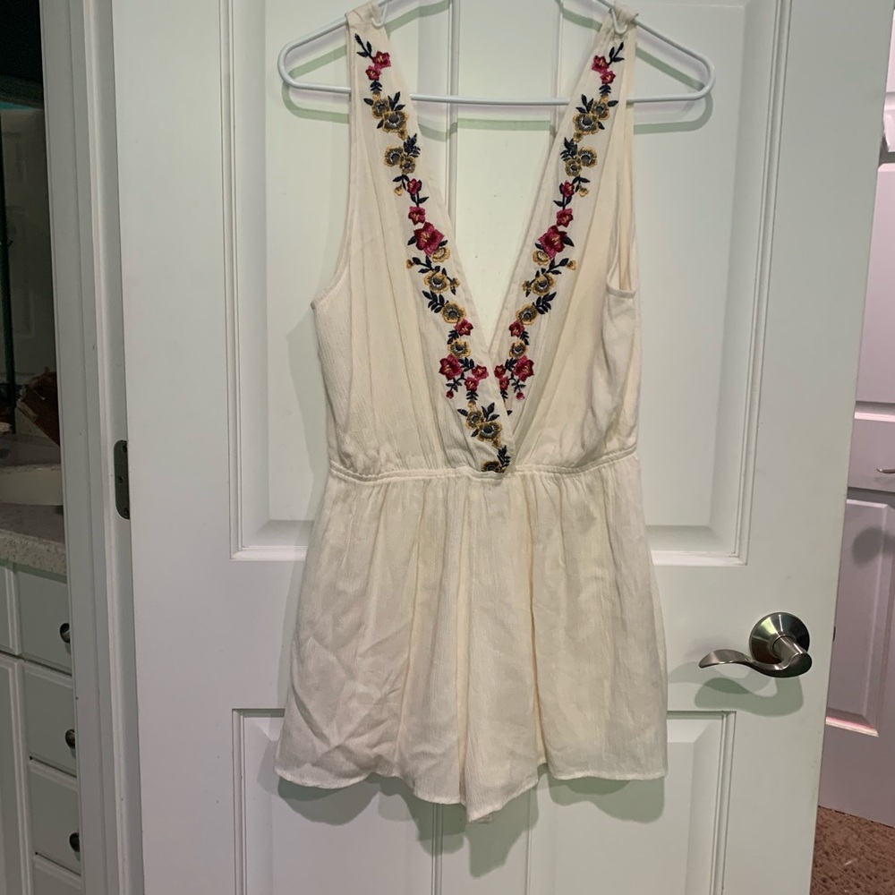 Medium super cute low cut body suit with flowers